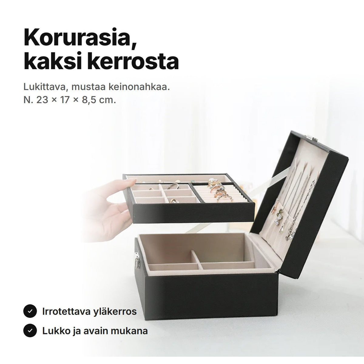 Musta kaksikerroksinen korurasia, yläkerros nostettuna
