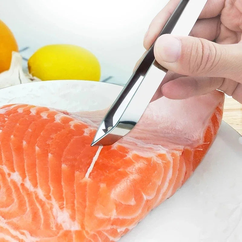 Ruotopihdit vinolla kärjellä vetävät ruodon lohifileestä