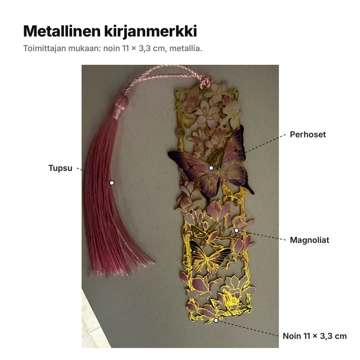 Metallinen kirjanmerkki selitettynä: tupsu, perhoset, magnoliat ja koko noin 11 × 3,3 cm