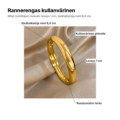 Rannerengas kullanvärinen selitettynä: sisähalkaisija noin 6,4 cm, kullanvärinen pinnoite, leveys 1 cm, ruostumaton teräs