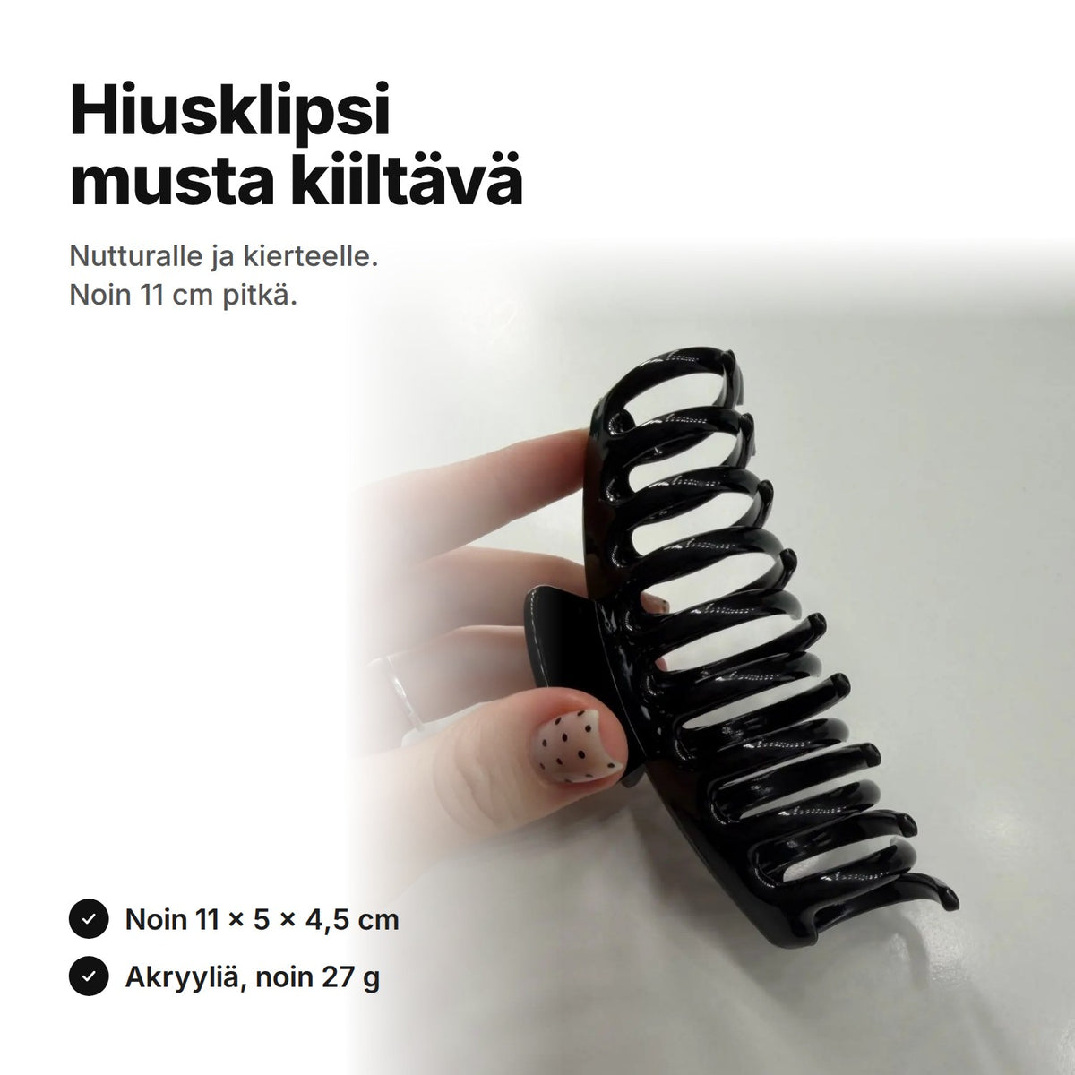 Kiiltävän musta hiusklipsi, noin 11 cm pitkä, 5 cm korkea ja 4,5 cm paksu