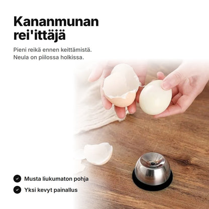 Kananmunan rei'ittäjä ja kuorittu kananmuna – neula piilossa holkissa, musta liukumaton pohja
