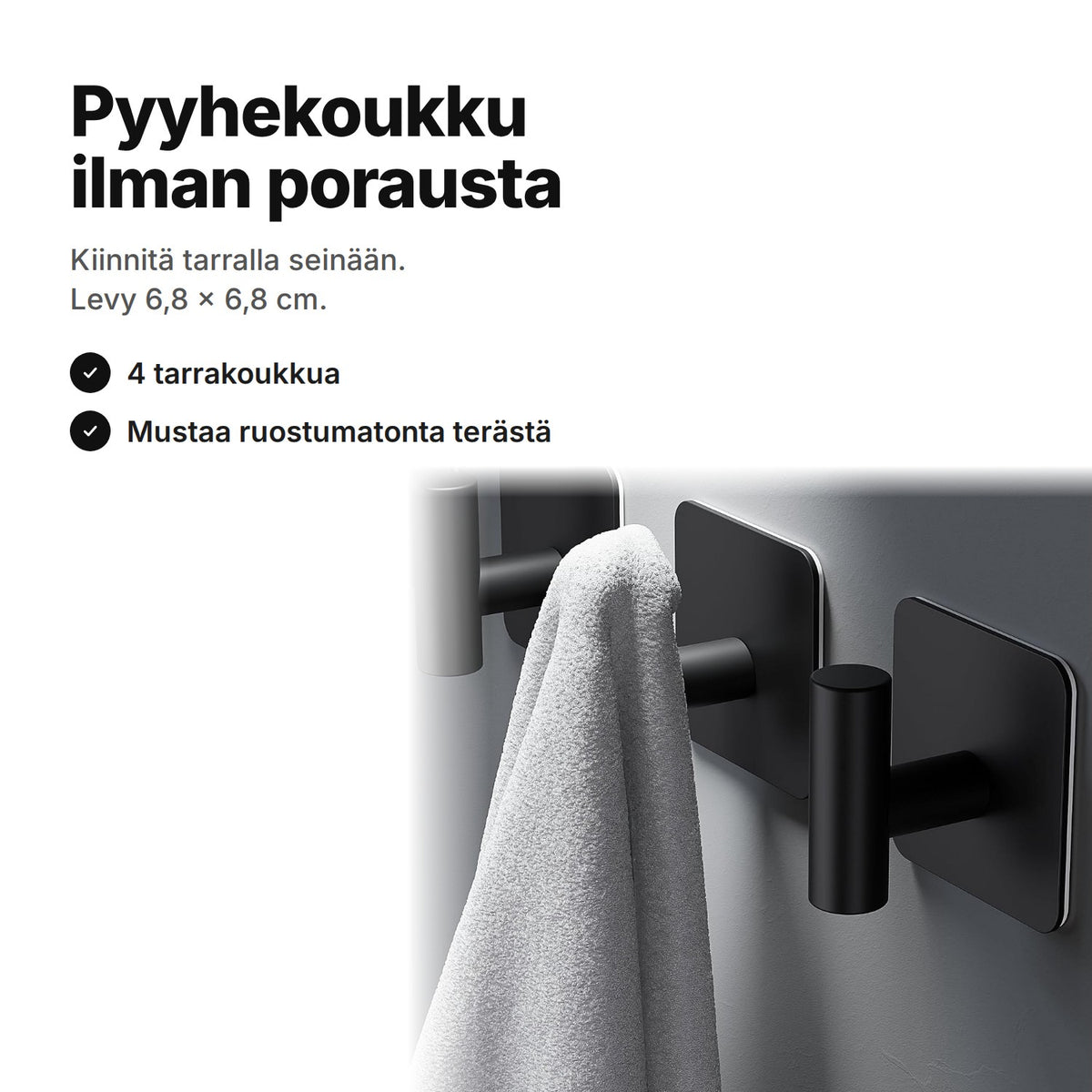 Pyyhekoukku ilman porausta: mustat tarrakoukut harmaalla seinällä, yhdessä koukussa pyyhe – levy 6,8 × 6,8 cm