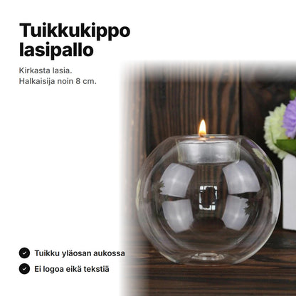 Pyöreä tuikkukippo kirkasta lasia, halkaisija noin 8 cm, tuikku yläosan aukossa